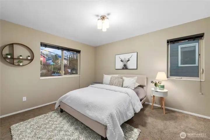 This guest room is comfortable and spacious with room for a king or queen bed and two night stands.