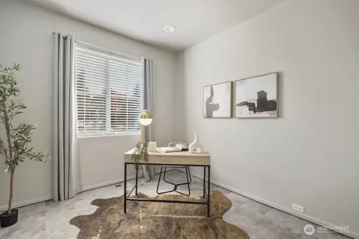 Bedroom on main floor staged as office.