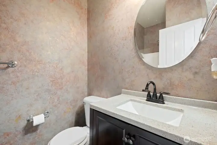 3/4 bath downstairs by bedroom staged as an office.