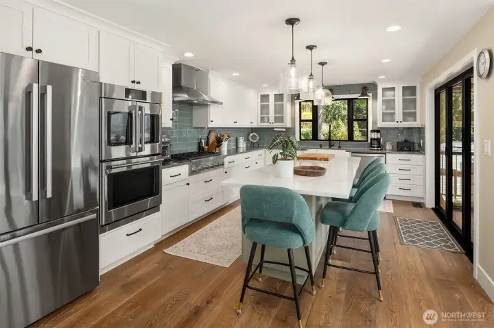 Remodeled kitchen; Quartz island, Thermador Gas Cooktop, GE Cafe double oven, microwave drawer, Bosch refrigerator/dishwasher, and pantry.
