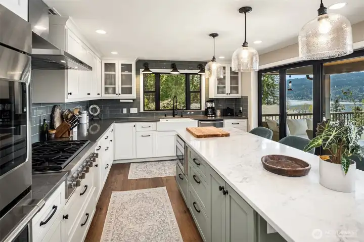 Remodeled kitchen; Quartz island, Thermador Gas Cooktop, GE Cafe double oven, microwave drawer, Bosch refrigerator/dishwasher, and pantry.