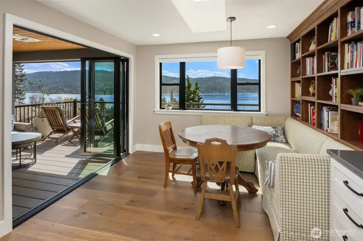 Eating nook with built-in seating, shelving and views.