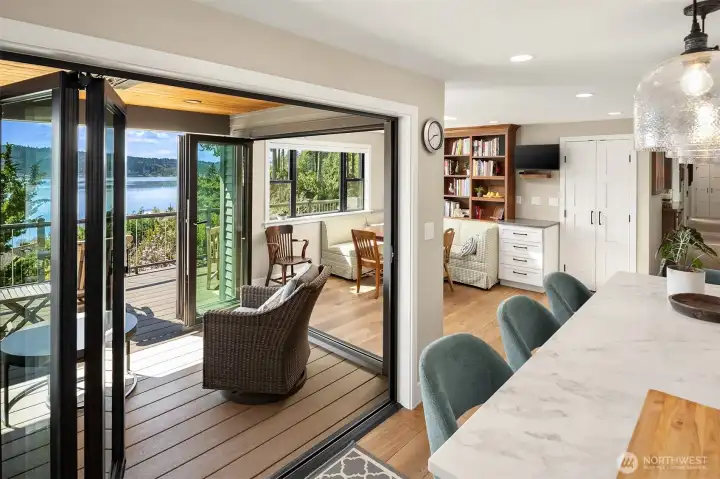 Dual NanaWall doors to a covered, heated deck – with stunning views - perfect for outdoor dining/lounging.
