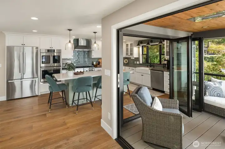 Dual NanaWall doors to a covered, heated deck – with stunning views - perfect for outdoor dining/lounging.