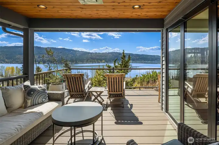 Dual NanaWall doors to a covered, heated deck – with stunning views - perfect for outdoor dining/lounging.