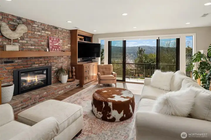 A perfect setup for extended family or guests downstairs with a Brand new, second, full kitchen with custom cherry cabinets. Large double recreation room with a gas fireplace, built-ins, with two desks-perfect for kids & homework. Huge laundry room. Relaxing steam shower. Double doors to lower decks.