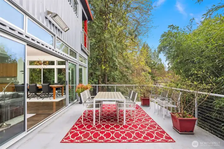The expansive deck is an ideal space for entertaining guests. Heated timers enhance year-round usability.