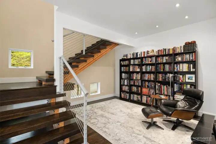 Dedicated library space with custom shelving. Yukimi shoji-style windows bring in natural serenity.