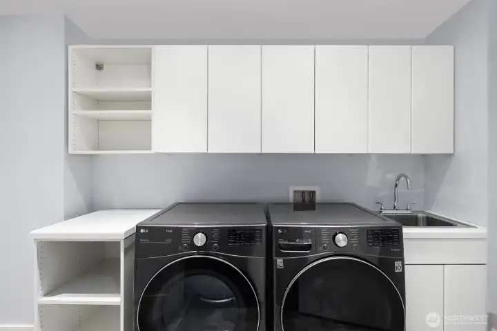 Dedicated laundry area with modern appliances.