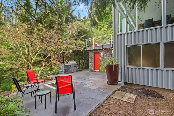 Large patio surrounded by nature and beauty.