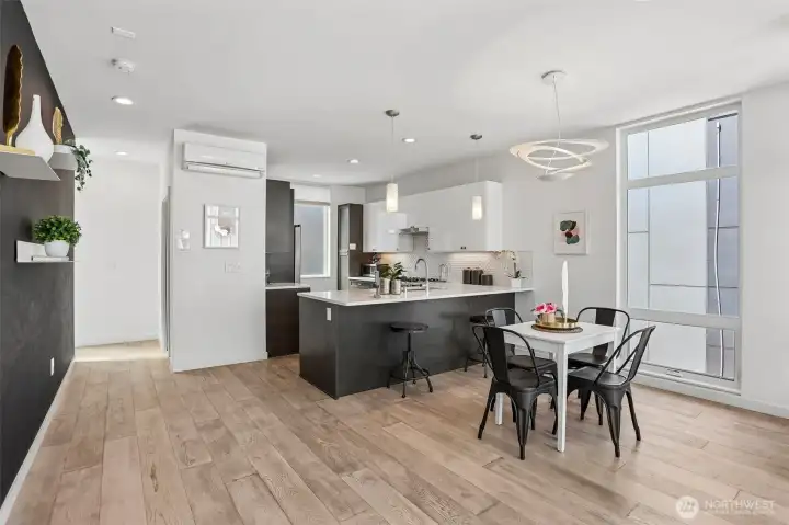 Gourmet kitchen with powerful range hood over five burner cooktop, and ultra-quiet Bosch dishwasher.