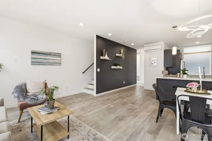 Stairs up to the rooftop deck.  That dining room fixture in the upper right is an Artemide light fixture imported from Italy.