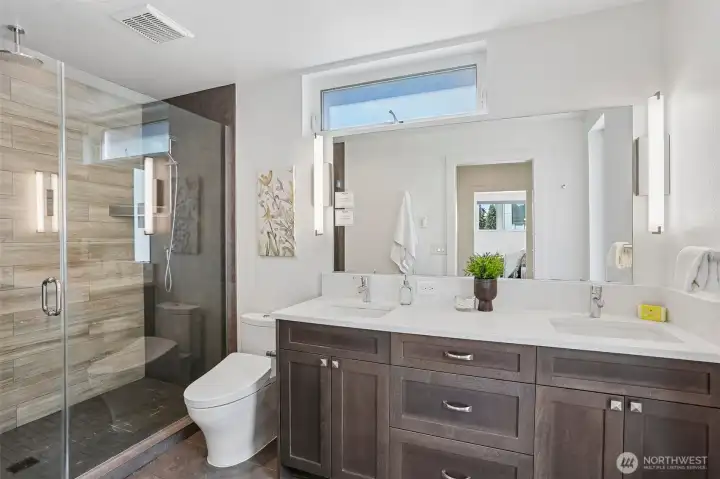 The primary bath with heated tile floors.