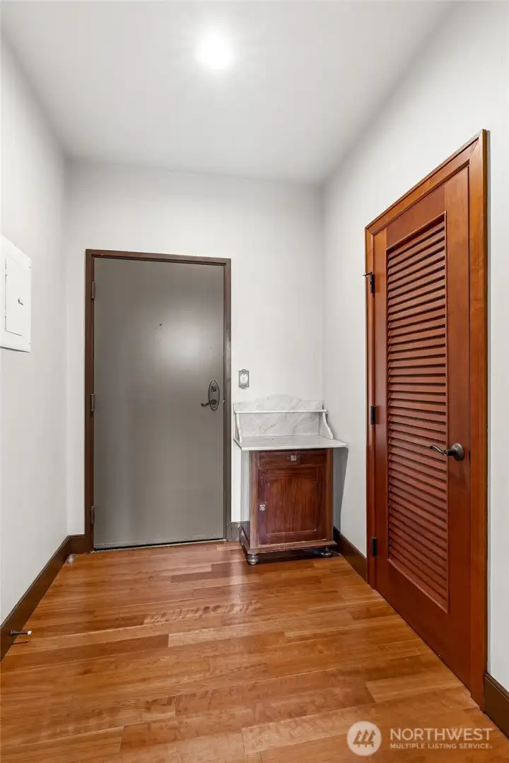 A beautifully finished entryway with timber flooring adds character and warmth upon arrival.