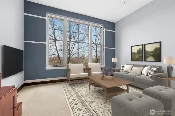 Tall ceilings and abundant natural light elevate this impressive urban retreat. This photo has been virtually staged.