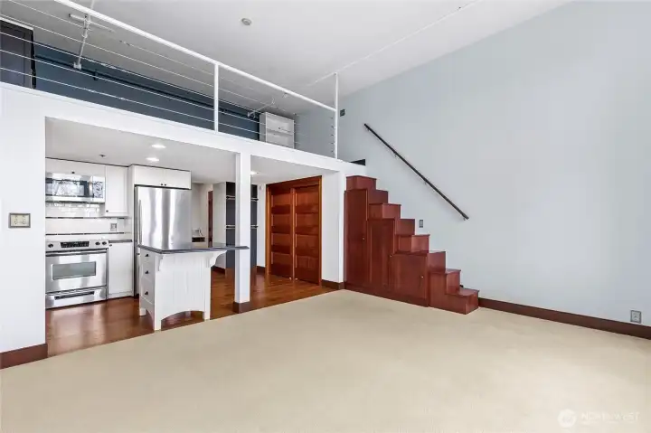 Grand ceiling height and a lofted bedroom design make this living space both spacious and unique.