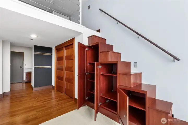 Beautiful wood stairs provide easy access to the loft bedroom while offering smart integrated storage beneath.