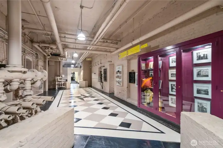 Basement hallway that offers a glimpse into the building’s history, full of preserved character.