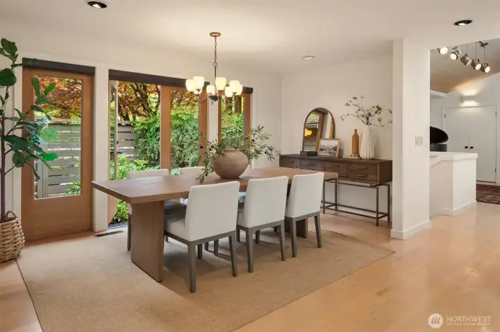 Inviting dining room with doors to another garden courtyard. Inviting dining room with doors to another garden courtyard.
