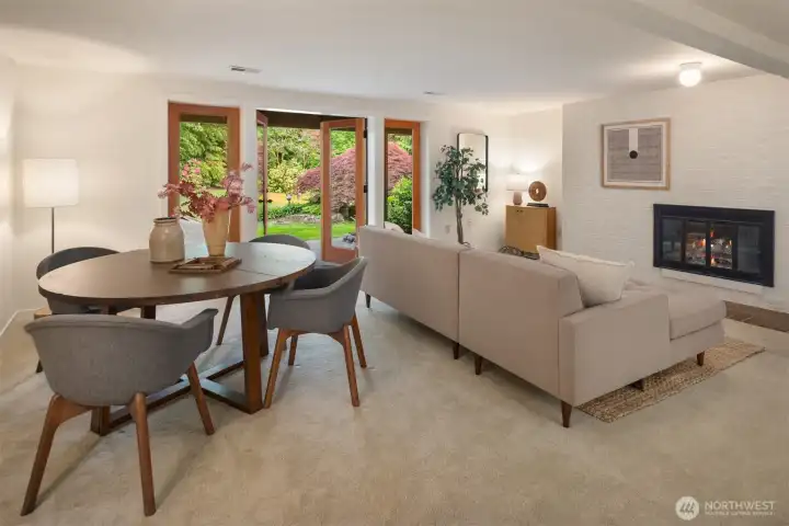 Lower level rec room with French doors to the backyard and wood-burning fireplace Lower level rec room with French doors to the backyard and wood-burning fireplace