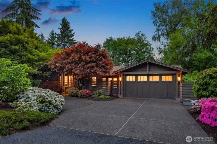 Attached two-car garage and circular driveway provides plenty of space for parking Attached two-car garage and circular driveway provides plenty of space for parking