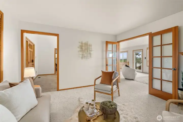 Formal living room that has french doors to open to family room.