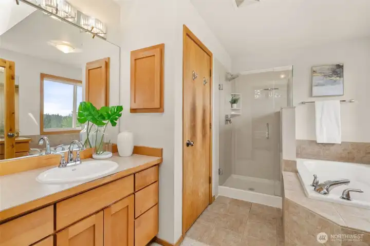 Primary bathroom with two separate vanities and sinks