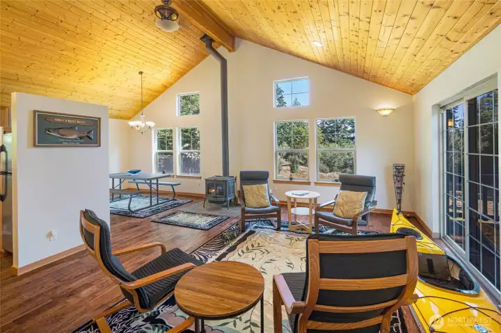 Open floor plan with soaring knotty pine ceiling...