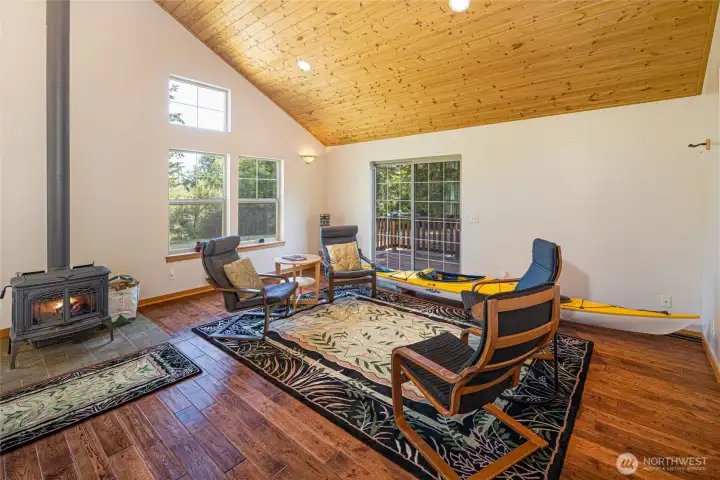 Cozy woodstove achors the living and dining space...