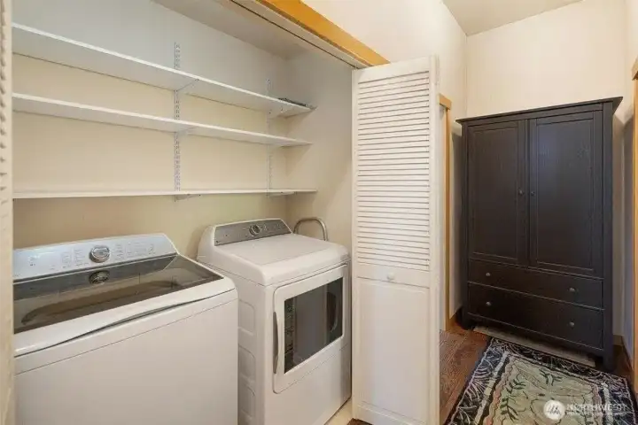 Modern washer and dryer with shelving in hallway closet... Modern washer and dryer with shelving in hallway closet...