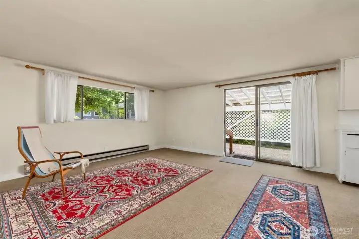Filled with natural light from three sides, the main room feels bright and open.