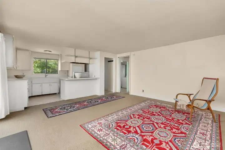 The main room is open to the kitchen, offering a bright and connected living space.