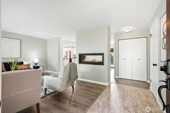 The stunning pass-through fireplace creates an elegant focal point enjoyed from multiple living spaces. The stunning pass-through fireplace creates an elegant focal point enjoyed from multiple living spaces.