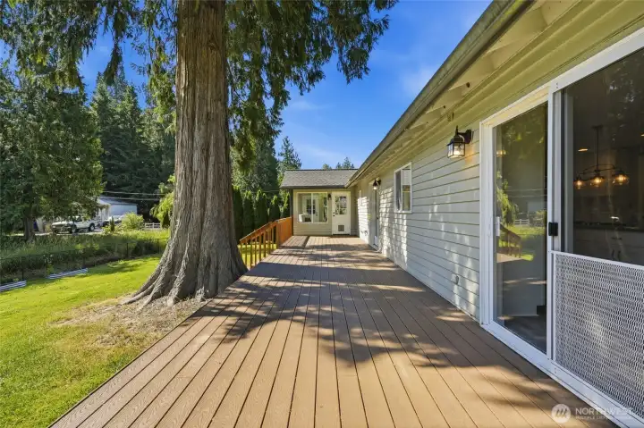 The expansive deck offers exceptional space for outdoor dining and entertaining. The expansive deck offers exceptional space for outdoor dining and entertaining.