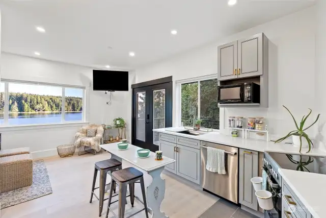 The kitchenette is so smartly designed. Need a private place for extended guests or maybe you need a multi-generational space? This room has it all. Close off the interior door and guests can come and go as they please from their private deck or for more privacy for you.