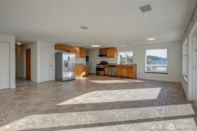 The living spaces are large enough to add an island, large dining table and lots of furnishings.  Note: Down each hall is a laundry closet.