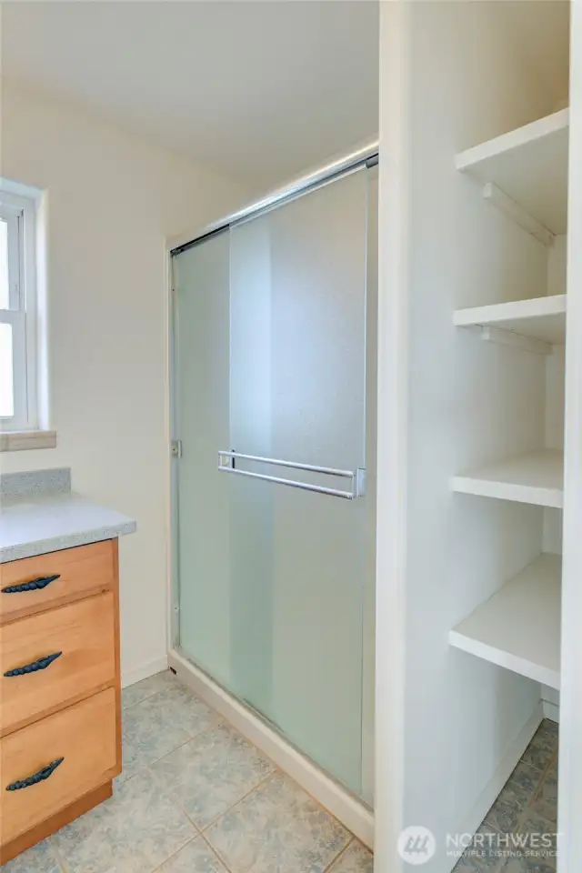 With oversized shower and storage.