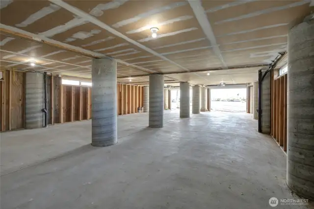 Underneath this home is a well constructed garage that protects the home from inclement weather.  Park your cars, boats and bring your ping pong table!