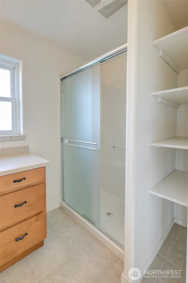 With oversized shower and storage.