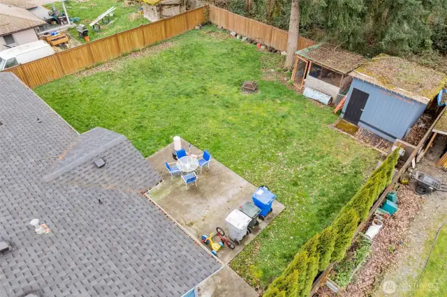 large back yard with patio