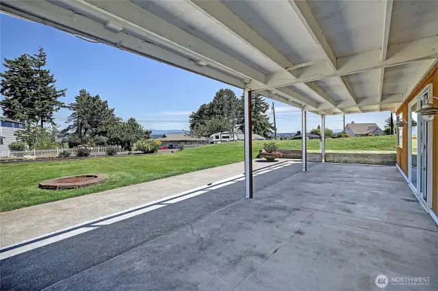 Huge patio, yard and fire pit on lower level.