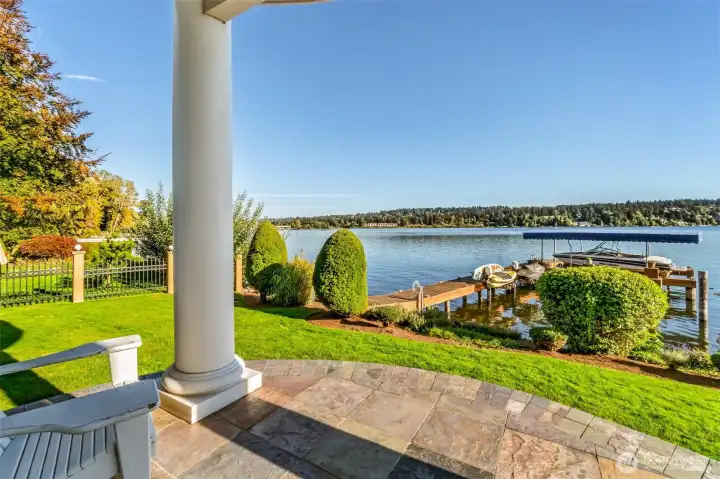 Morning coffee with your view! Step out to your private terrace overlooking the lake and manicured grounds.