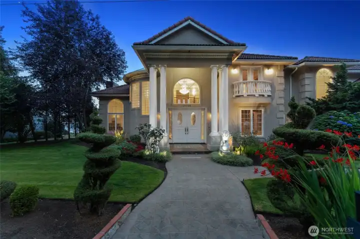 Grand curb appeal! Lush landscaping, and architectural drama-this home makes a powerful first impression!