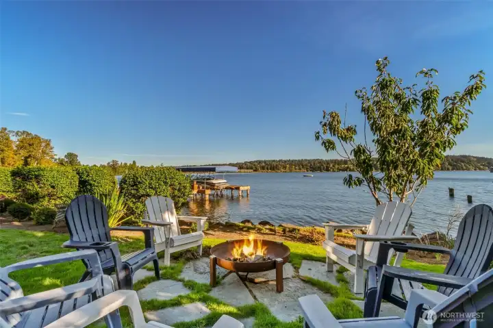 The perfect fire pit spot. Watch the sun set, roast s'mores, and gather lakeside on your own property.