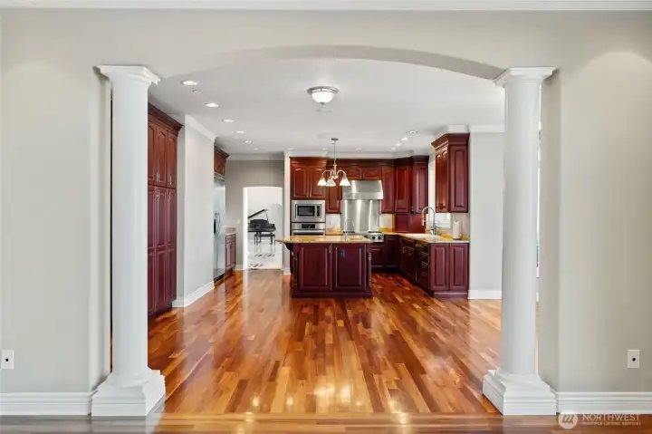 Warm hardwoods lead to a cozy dining nook with timeless charm.