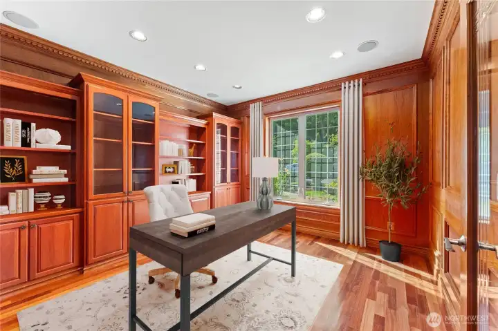 Elegant home office with custom built-ins and serene natural light. Digitally Staged