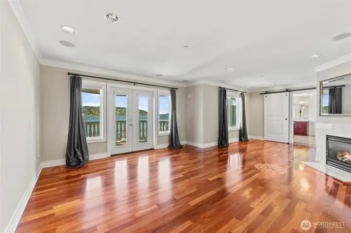 Primary suite, untouched and full of potential. Light, volume, and room to create your lakeside sanctuary.