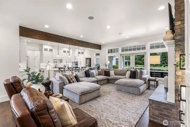 Great room opens to kitchen and breakfast nook. The french doors lead to the covered outside patio and entertainment area.