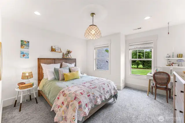 3rd upper bedroom with room for desk and lots of natural light.