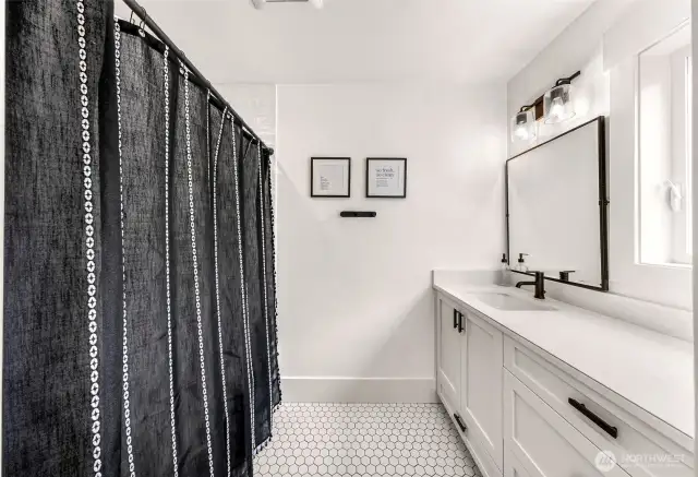 Upper bath with tub shower and 3rd vanity.